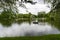 Family boating on the lake in the Park, around the trees. Horizontal orientation