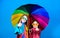 Family bonds. Small girls in raincoat. rain protection. Rainbow. autumn fashion. cheerful hipster children, sisterhood