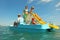 Family with boy and girl on pedal boat