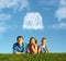 Family with boy on grass and dream cloud house