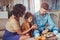 Family Breakfast. Young attractive family having breakfast at home sitting on a sofa.