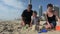 Family builds sand castle in Surfers Paradise Australia