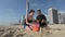Family builds sand castle in Surfers Paradise Australia