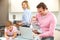 Family busy together in kitchen