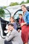Family buying car, mother, father and child at dealership
