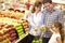 Family buying fruit in supermarket