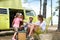 Family camping with a vintage camper van