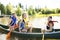 Family in a Canoe on a Lake having fun