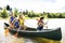 Family in a Canoe on a Lake having fun