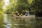 Family canoe ride down a beautiful tropical river