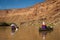 Family in canoes on desert river