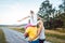 Family carrying child piggyback on summer walk