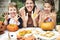 Family carving Halloween jack-o`-lanterns