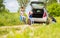 family changes the tyre of the car