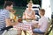 Family chatting during lunch on camper trip