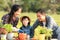 Family child girl helping parent care plant flower in garden. Young people mother,