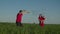 Family with child playing with huge soap bubbles