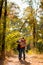 Family with child walking in autumn Park. walks in nature
