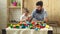 Family and childhood concept. Dad and kid build plastic blocks. Father and son with happy faces create colorful toys