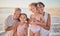 Family, children and beach with a girl, grandparents and sister on the sand by the ocean or sea at sunset. Kids, summer