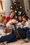 Family with children enjoy for Christmas at home