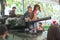 Family and children enjoy fun with military tanks guns and canon army weapons show