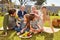 Family with children and grandparents having a picnic