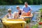 Family with children kayaking on the river