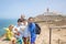 Family with children, siblings, visiting the most west point of Europe, Cabo Da Roca, during family vacation summertime