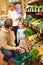 Family Choosing Fresh Vegetables In Farm Shop