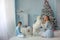 Family Christmas photo of mother and adult son with Pets purebred Samoyed