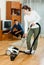 Family cleaning with vacuum cleaner in home