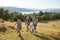 Family Climbing Hill On Hike Through Countryside In Lake District UK Together