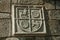 Family coat of arms carved on stone in a medieval chapel