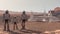 Family colonists immigrants to Mars, a man, a woman and a child admire the Martian landscape, the city and spaceship. Exploring
