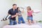 Family Concepts and Ideas. young Caucasian Family Having a Playful Funny Pillow Fight Indoors