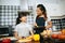 Family cooking time : Happy family help cooking meal together in kitchen