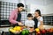 Family cooking time : Happy family help cooking meal together in kitchen