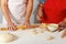 The family cooks together in the kitchen, close-up.