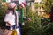 Family couple choosing christmas tree at christmas fair