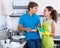 Family couple washing dishes