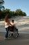 Family couple with wheelchair at stairs, handicap