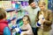 Family of customers with children purchasing milk