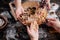 Family cutting cookies of raw gingerbread dough