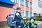 Family cycling, father with happy kid riding bike outdoors