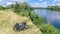 Family cycling outdoors, bicycles near river, aerial view of bikes and helmets from above, sport and fitness