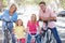 Family Cycling On Suburban Street