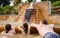 Family, dad and children bathe, swim in outdoor dirty hot springs. Thermal water bath pool and healthy natural, clay and