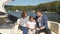 Family with daughter vacation together on sailboat in lake