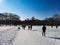 Family day walk hyde park London city winter day snow footsteps grass blue sky no clouds empty trees united kingdom uk